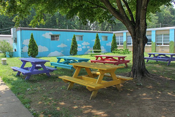 colorful picnic tables outside